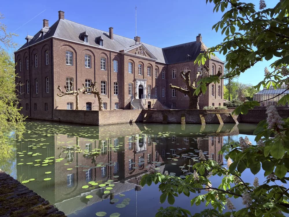 Arcen Castle in Limburg, Netherlands — the 1709 baroque manor shell whose interior was destroyed in 1944, now the centrepiece of the Kasteeltuinen Arcen, one of the Netherlands' most elaborate garden estates