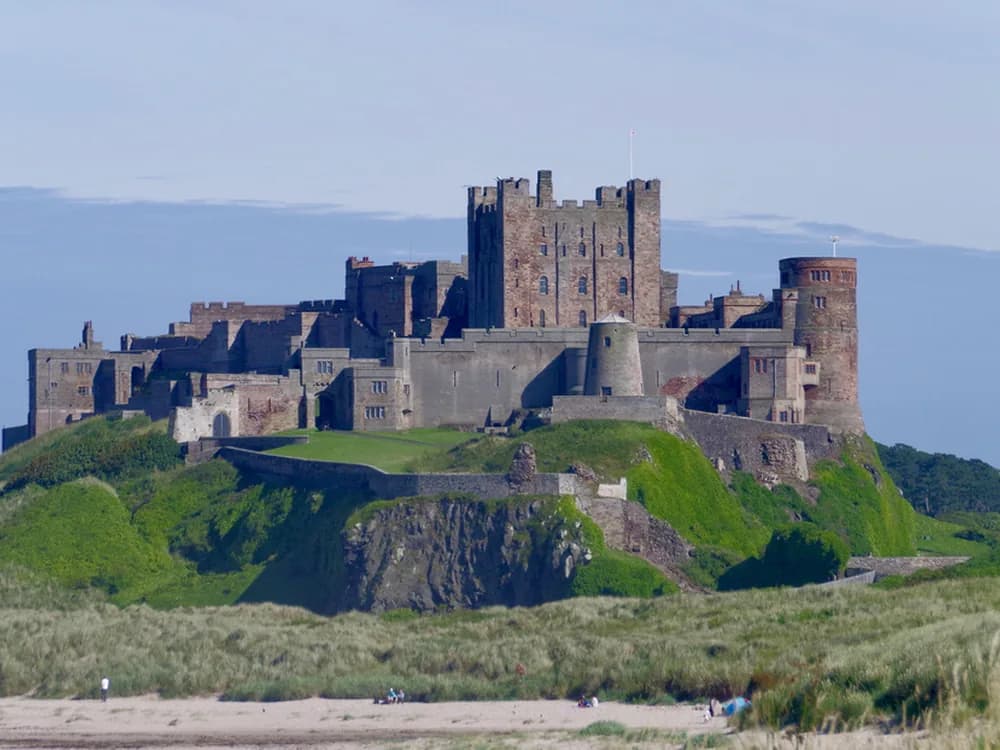 Bamburgh Castle rising from the basalt rock above the Northumberland coast
