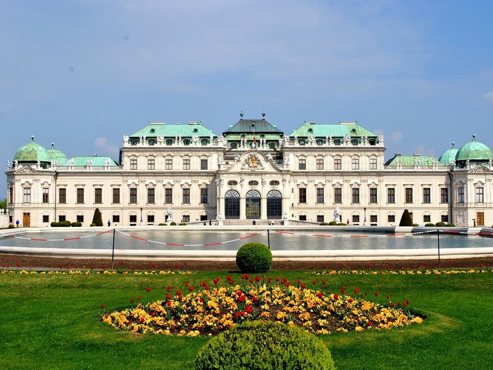 The Upper Belvedere palace in Vienna seen across its Baroque garden, with a cascade of fountains descending the central axis
