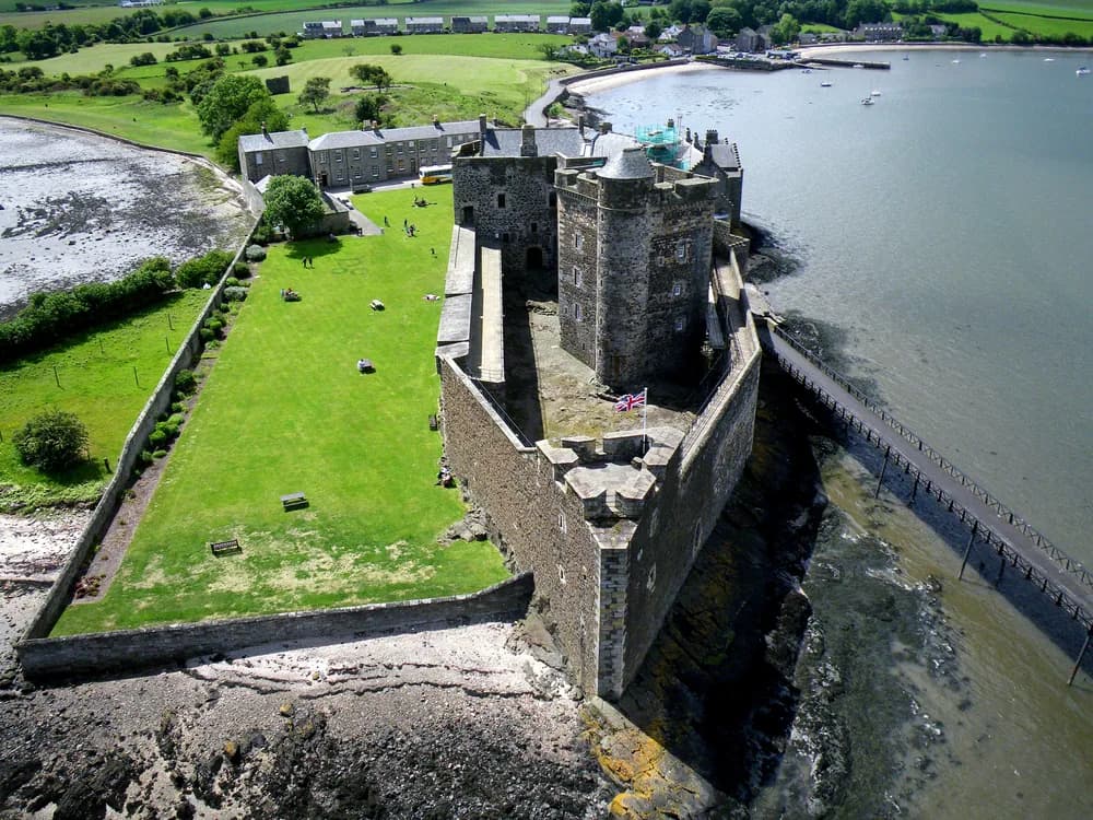 Blackness Castle on its Firth of Forth promontory in West Lothian — the ship-shaped medieval fortress and former Scottish state prison, viewed from the water