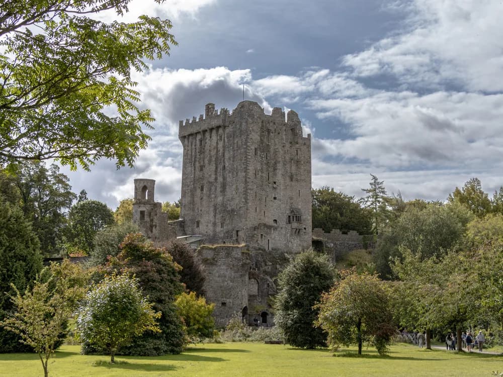 Blarney Castle tower rising from woodland gardens in County Cork, Ireland