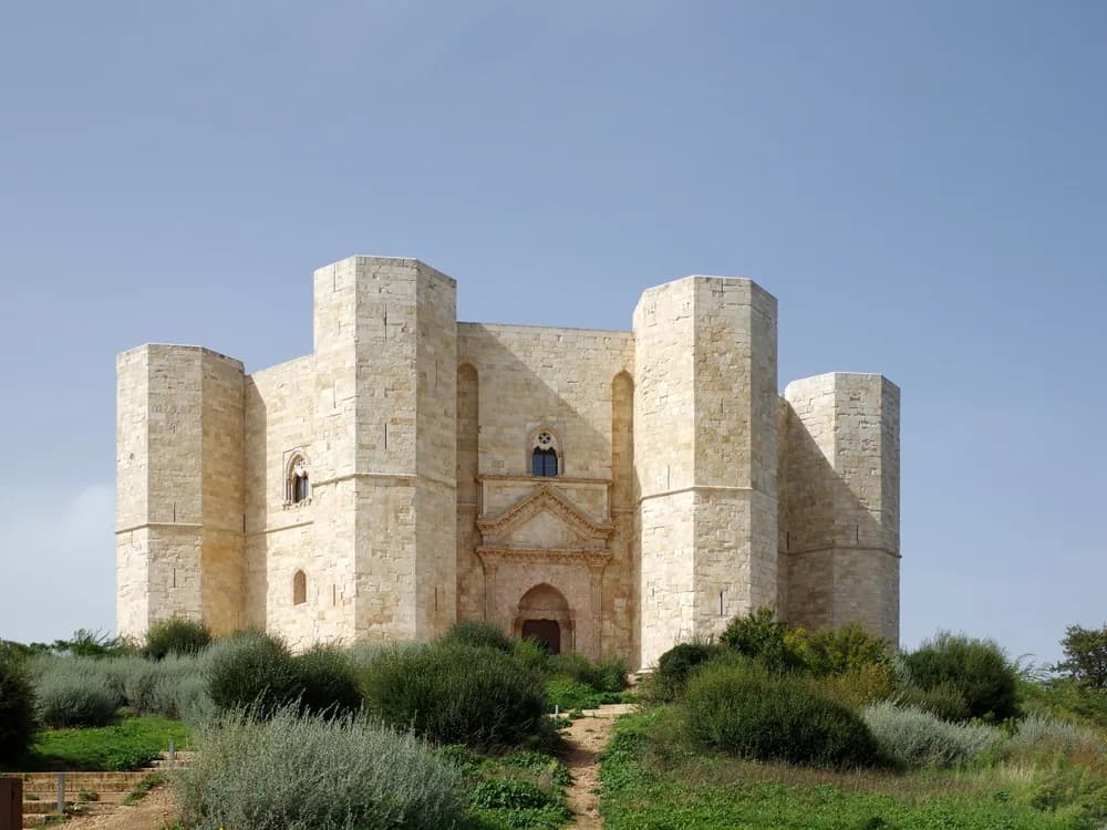 Castel del Monte on its solitary hill above the Apulian plain, its eight octagonal towers casting long shadows