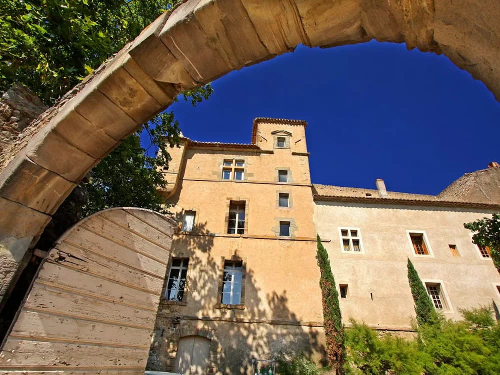 Château de Luc in the Minervois wine country, Languedoc — a 14th-century fortified castle with medieval wine cellar and organic vineyards in the Aude garrigue