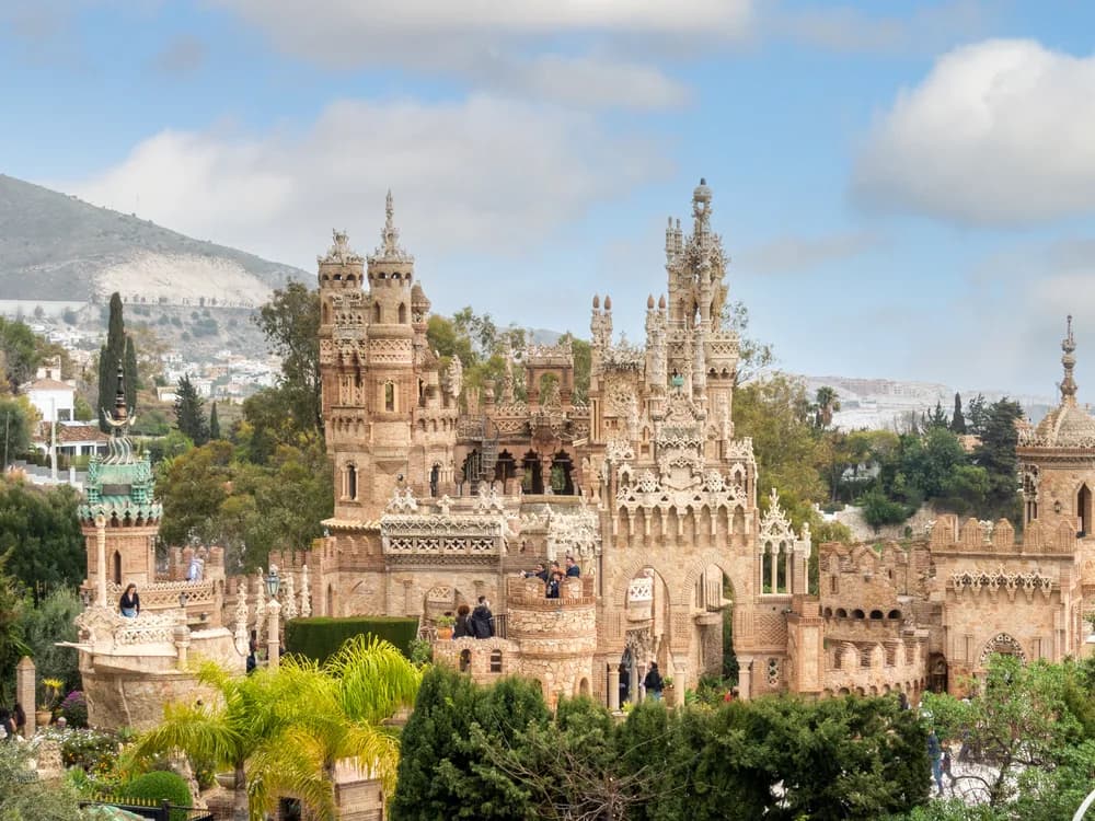 Castillo de Colomares in Benalmádena, Málaga province — a 20th-century monument to Christopher Columbus built 1987–1994 combining Byzantine, Romanesque, Gothic, Mudejar, and Renaissance architectural styles, housing the world's smallest church