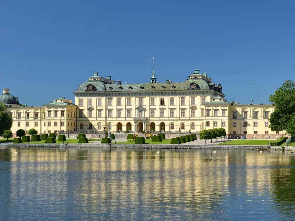 Drottningholm Palace Baroque facade reflected in Lake Mälaren near Stockholm, Sweden