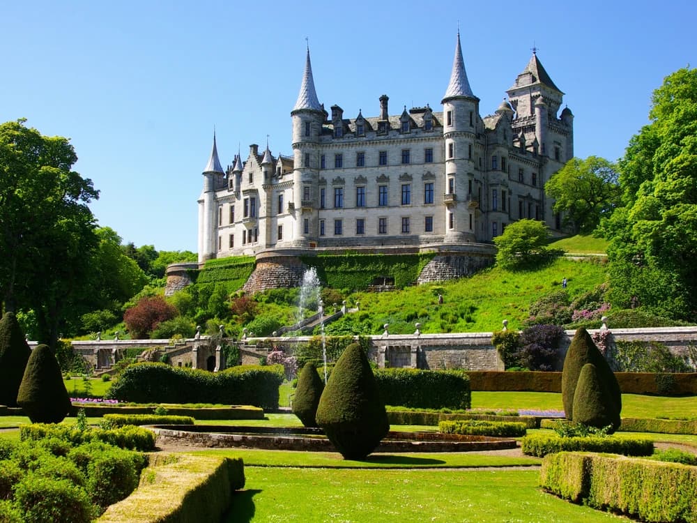 Dunrobin Castle rising above its formal gardens above the Moray Firth in Sutherland, Scotland