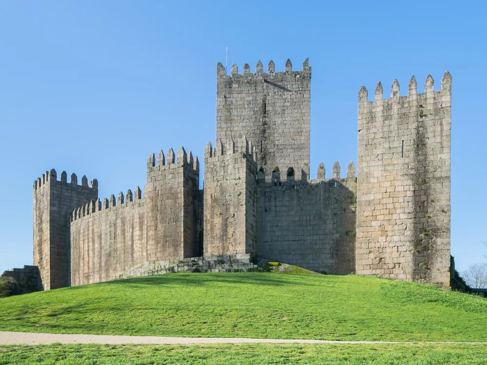 Guimarães Castle with its eight medieval towers above the rooftops of the historic town