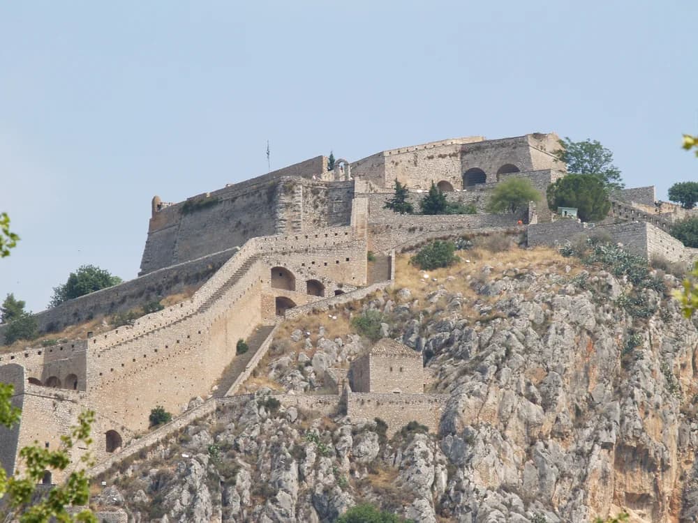 Palamidi Fortress on its hilltop above the Argolic Gulf with Nafplio old town visible below, Greece