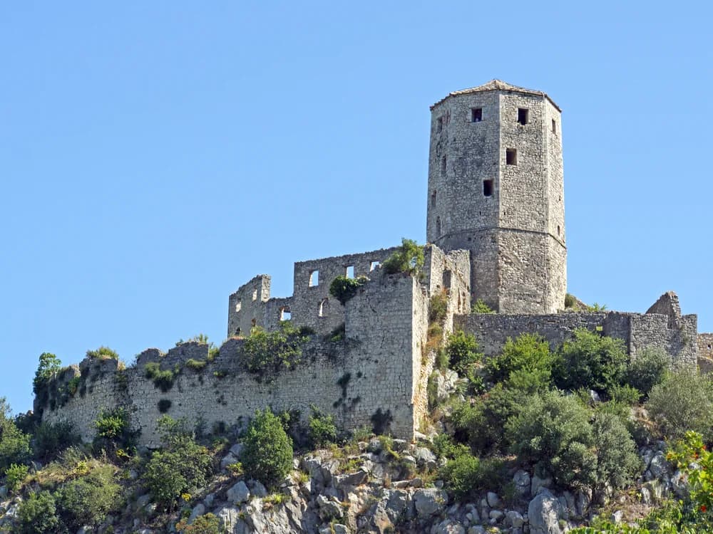 Počitelj Ottoman village and citadel tower on a limestone cliff above the Neretva River in Bosnia