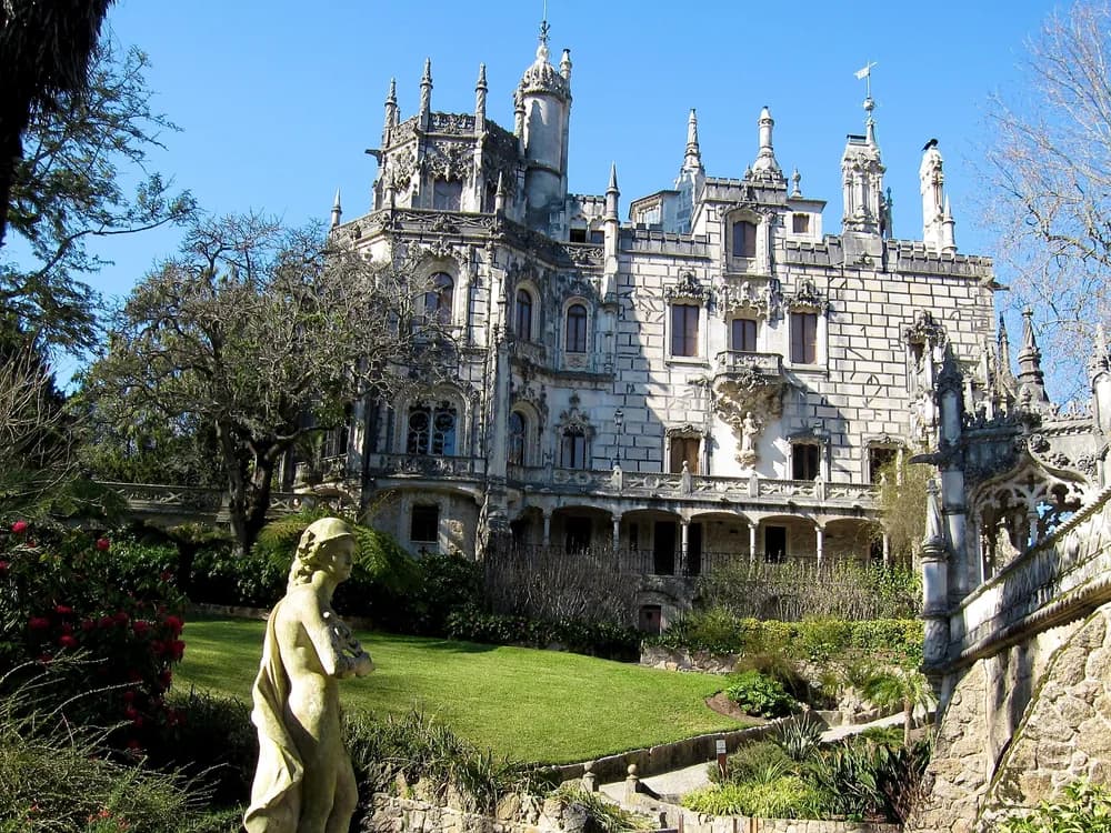 Quinta da Regaleira's Initiation Well — the spiral staircase descending 27 metres through nine platforms into the underground tunnel network, Sintra, Portugal
