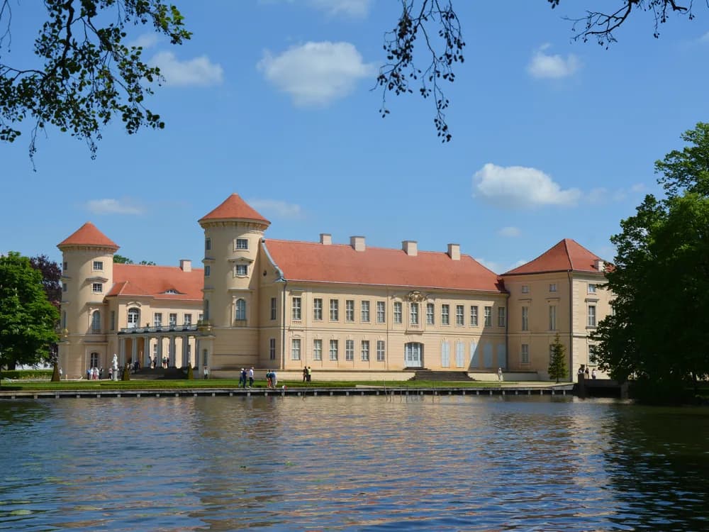 Rheinsberg Palace's Baroque facade reflected in the lake in Brandenburg, Germany