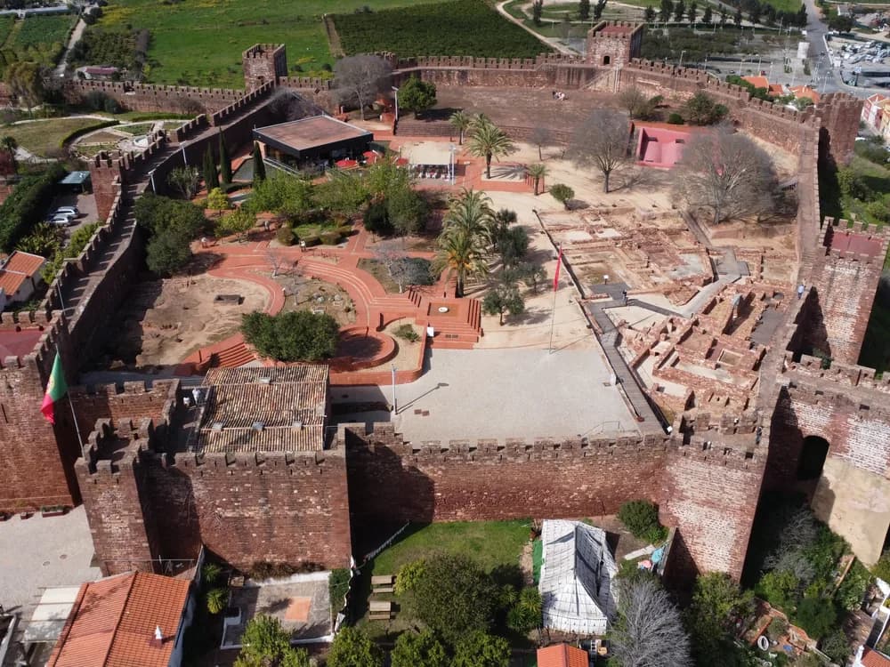 Silves Castle red sandstone walls above the Arade River in the Algarve