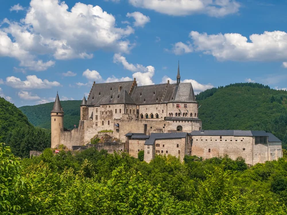 Vianden Castle towers above the Our River valley and medieval town in Luxembourg