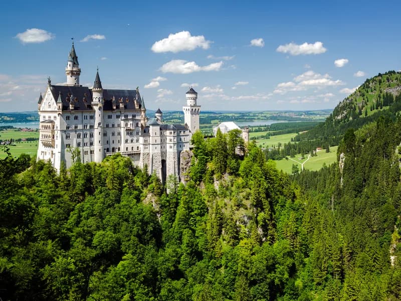 Neuschwanstein Castle seen from Marienbrücke in autumn gold