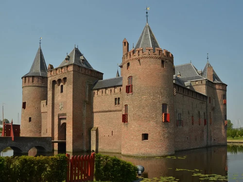 Muiderslot medieval water castle reflected in the moat, Netherlands