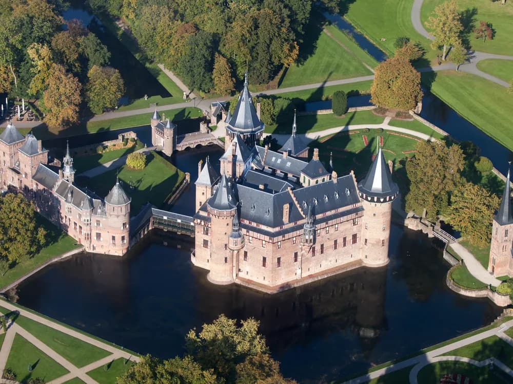 Kasteel De Haar's Gothic Revival towers reflected in the moat, near Utrecht, Netherlands
