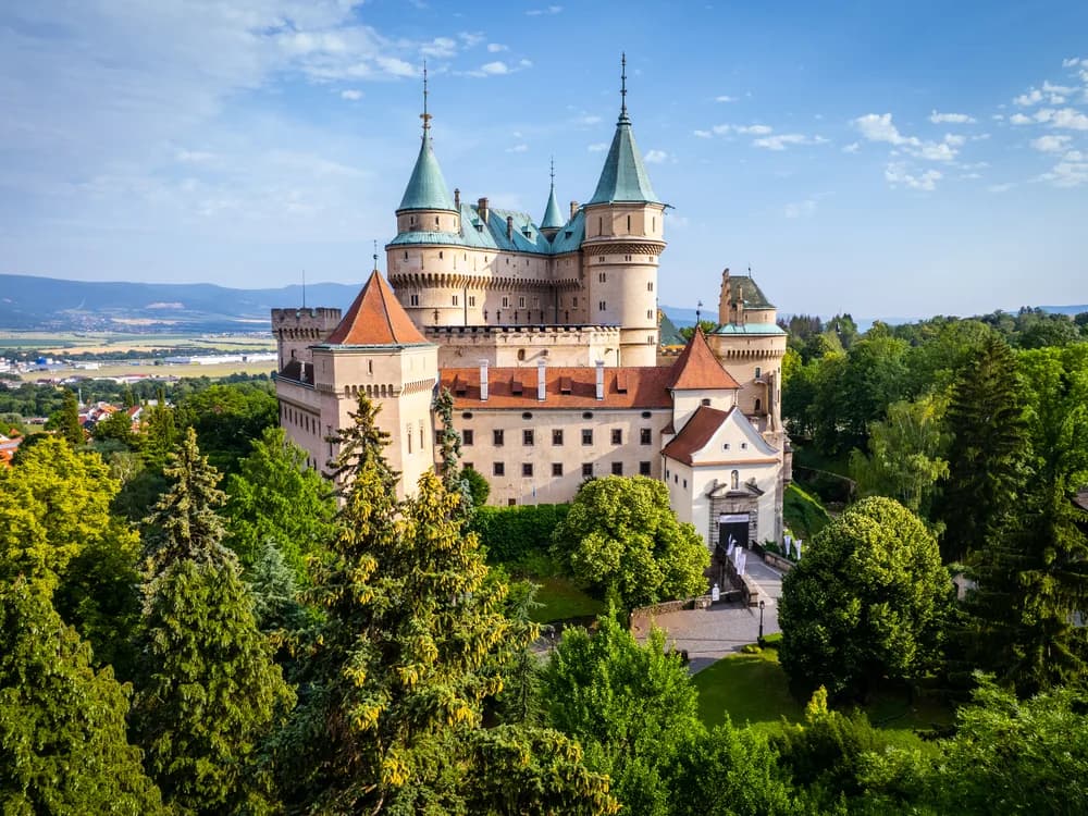 Bojnice Castle's neo-Gothic towers rising above the moat in the Nitra Valley, Slovakia