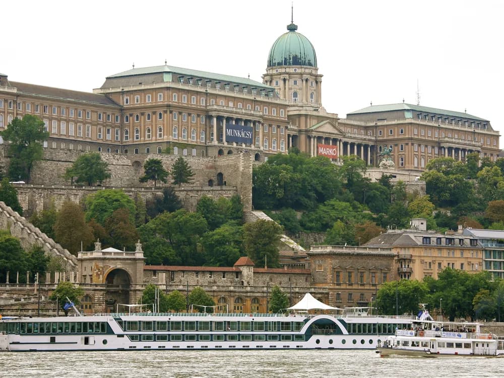 Buda Castle and the Fisherman's Bastion reflected in the Danube at sunset