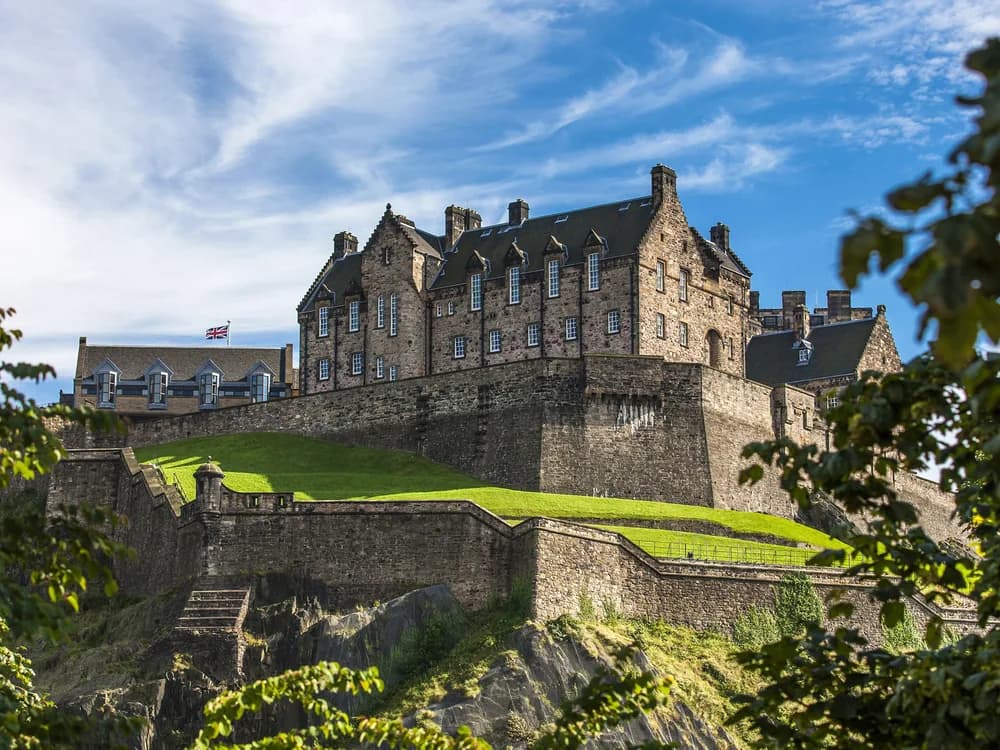 Edinburgh Castle perched on its volcanic rock above the city at dusk