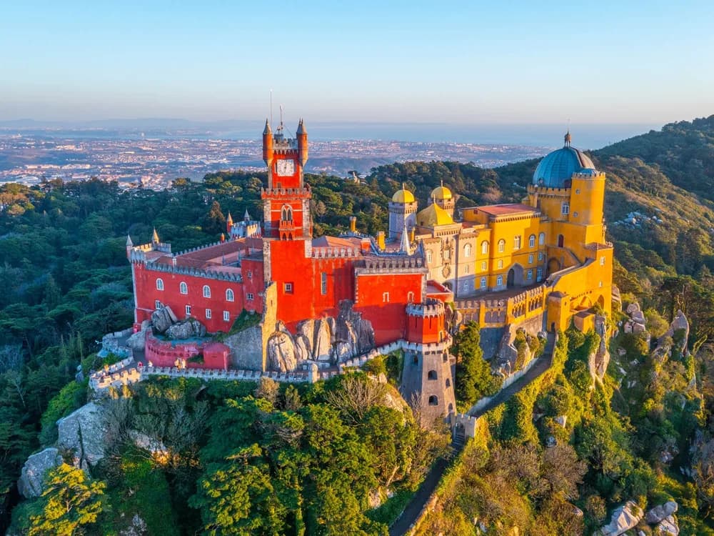 Pena Palace rising above the forest of Sintra in vivid yellow and red