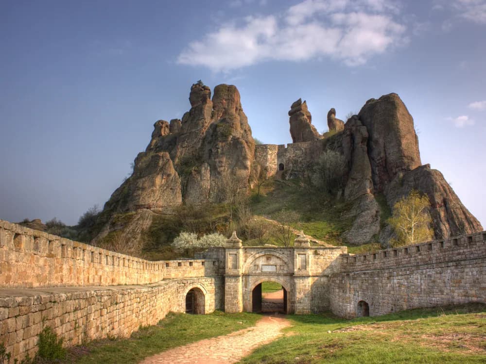 Belogradchik Fortress towers and medieval walls built into red sandstone rock formations in Bulgaria