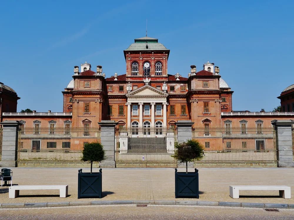 The Royal Palace of Racconigi above its landscaped English park — the Savoy court's preferred spring residence in the Po plain south of Turin