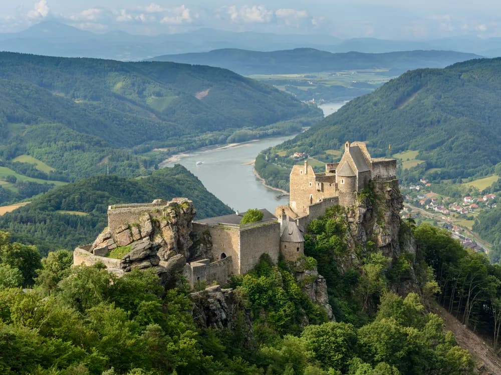 Aggstein Castle ruins on their rock spur 300 metres above the Danube in the Wachau UNESCO World Heritage cultural landscape — Austria's most dramatically positioned castle ruin, associated with 15th-century robber baron Schreckenwald