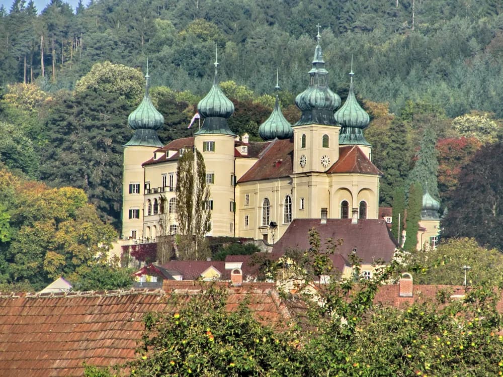Artstetten Castle with its seven towers above the Lower Austrian countryside near the Wachau Valley — the Habsburg castle where Archduke Franz Ferdinand and Duchess Sophie are buried in the castle crypt