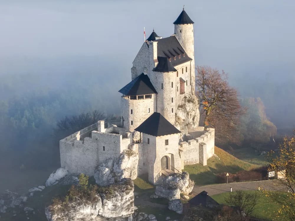 Bobolice Castle on its limestone outcrop in the Polish Jurassic Highland — the fully reconstructed Eagles' Nests fortress of Casimir the Great, 700 metres south of Mirów Castle, rebuilt 2004–2011