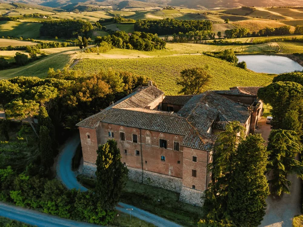 Castello Tricerchi in the Brunello di Montalcino vineyards — the Templar-founded medieval castle at Località Altesi, Montalcino, in the Val d'Orcia UNESCO landscape of southern Tuscany