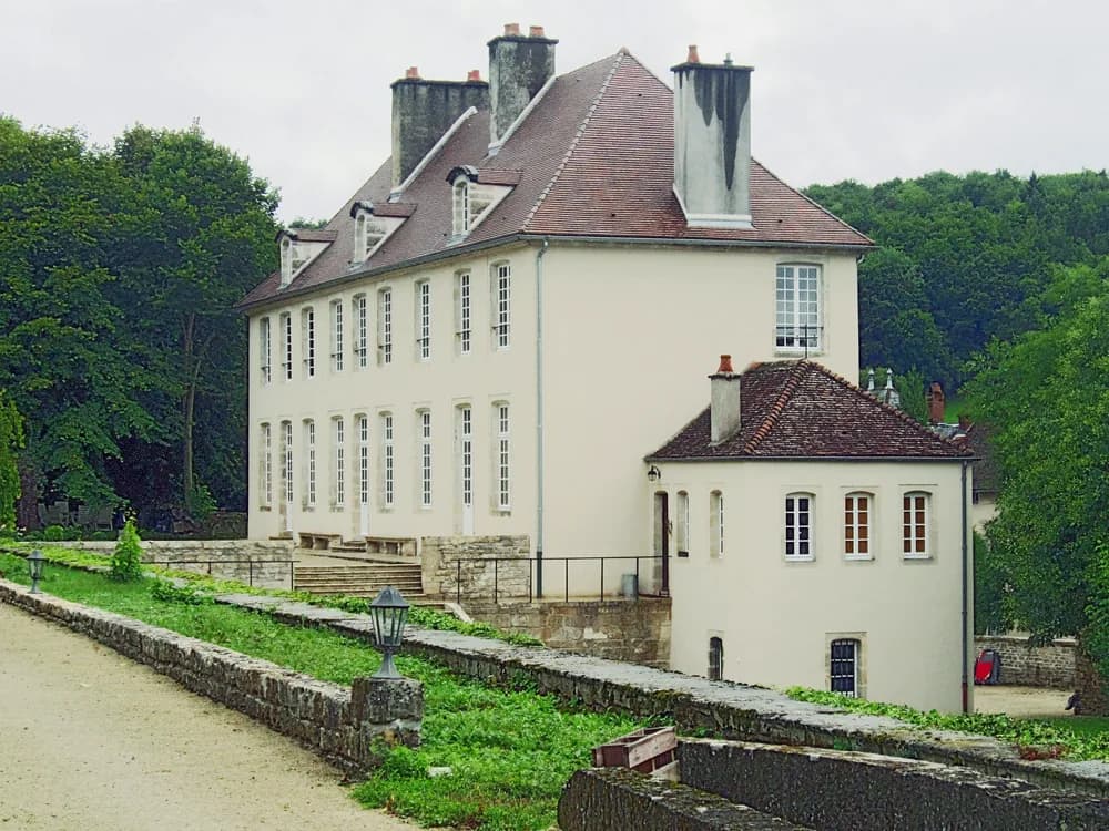 Château de Tavannes in the Châtillonnais countryside of northern Burgundy — the 18th-century classical estate with a medieval turret, listed Historic Monument of France since 1988