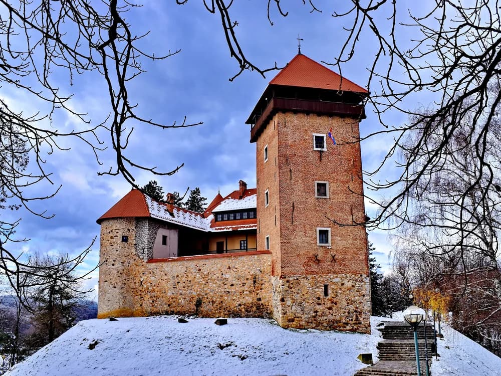 Dubovac Castle on its hilltop above Karlovac and the four-river confluence — the Frankopan and Zrinski Croatian Military Frontier fortress now housing the Karlovac City Museum