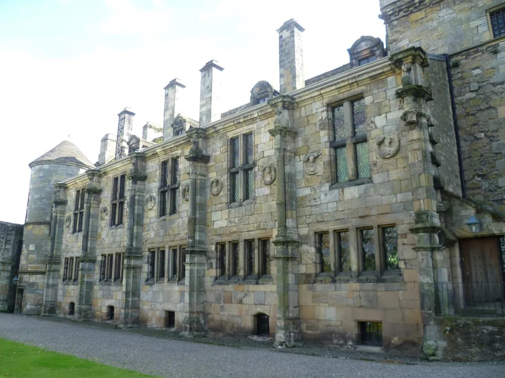Falkland Palace in Fife, Scotland — the twin drum towers of the Stuart dynasty's French Renaissance country retreat, built by James V in the 1530s and managed by the National Trust for Scotland