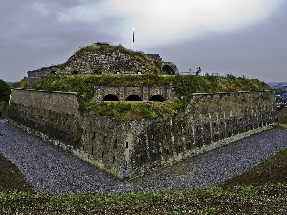 Fort Sint Pieter on the St Pietersberg hill above Maastricht, Netherlands — the 1701–1702 Dutch Baroque hornwork fortress designed by Isaac van Couhorn, with its network of limestone underground passages carved with three centuries of military inscriptions