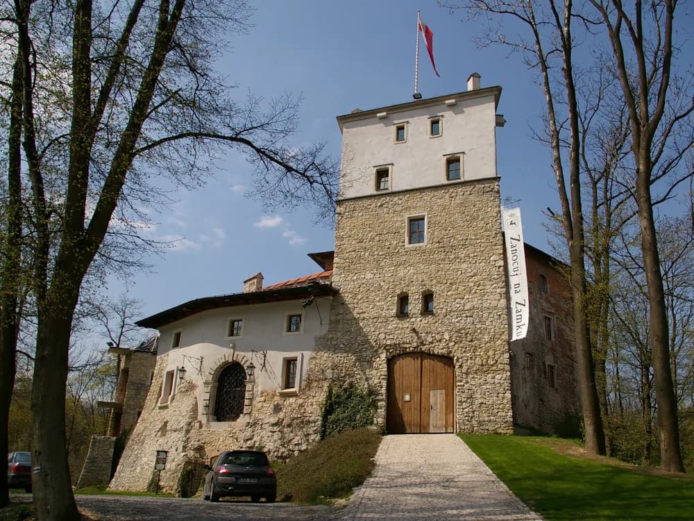 Korzkiew Castle on its limestone hilltop south of the Polish Jurassic Highland — the southernmost Eagles' Nests fortress, restored in 1997 as a boutique hotel, 12 km north of Kraków