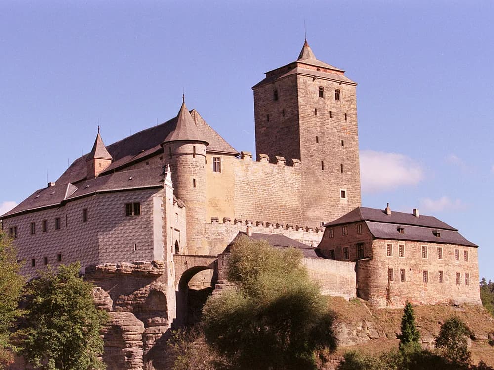 Kost Castle in the Bohemian Paradise — the 14th-century Gothic fortress hidden among three valleys in the Czech UNESCO Geopark, with the White Tower rising from the limestone outcrop