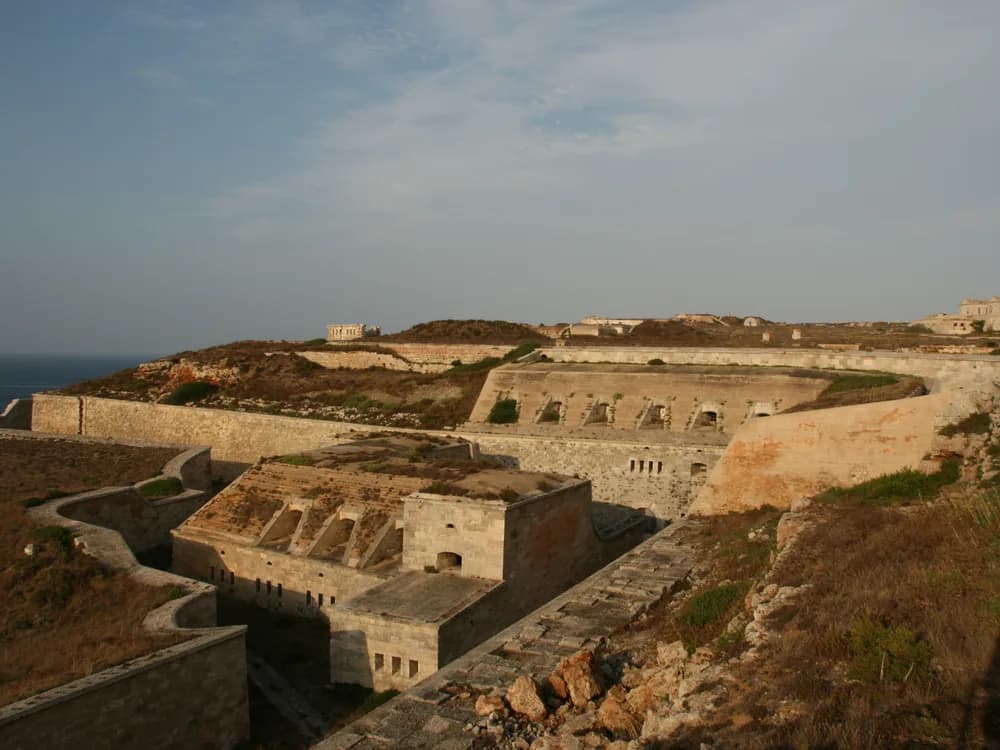 La Mola, Fortress Isabel II on the headland above Menorca's Port of Mahón — the 19th-century Spanish military fortification built to stop British seizure of the island's strategic harbour