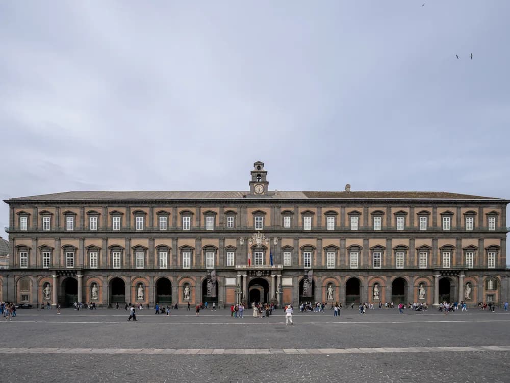 The Naples Royal Palace on Piazza del Plebiscito — the Baroque palace of the Spanish viceroys and Bourbon kings of the Two Sicilies, with eight dynastic statues on its principal facade