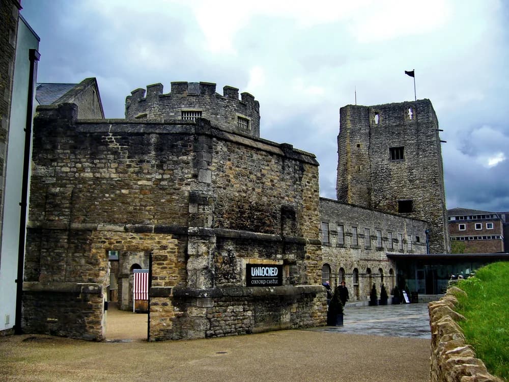 Oxford Castle and Prison — St George's Norman Tower rising above the 18th and 19th-century prison buildings in central Oxford, housing nearly 900 years of incarceration history