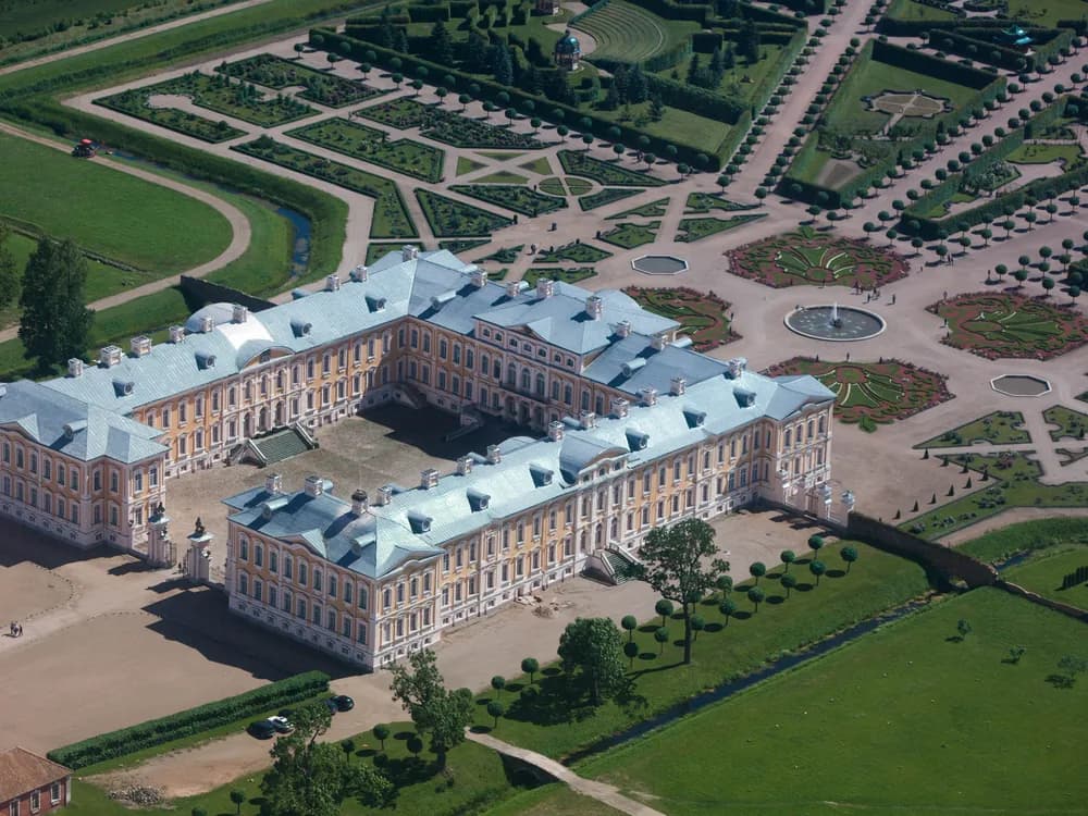 Rundāle Palace in Latvia — Rastrelli's Baroque masterwork for the Duke of Courland, with yellow-ochre facade and restored formal French gardens in the Zemgale countryside