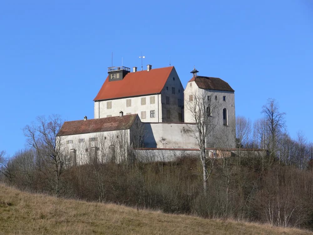 Waldburg Castle on its Upper Swabia hill — the ancestral seat of the Hereditary Marshals of the Holy Roman Empire, with views toward Lake Constance and the Allgäu Alps