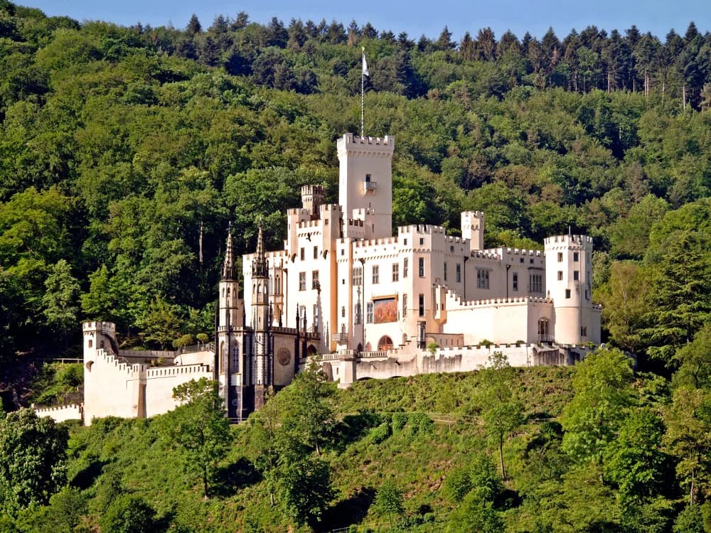 Marksburg Castle rising above the Rhine Valley on its hilltop above Braubach, Germany, seen from the river