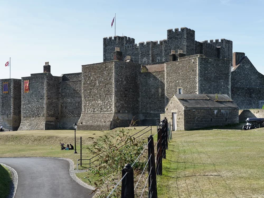 Dover Castle on the chalk cliffs above the Strait of Dover — England's most strategically important fortress, with the White Cliffs visible along the coastline