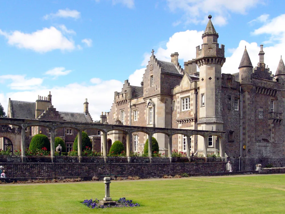Abbotsford House's Scottish Baronial towers and battlements on the banks of the River Tweed