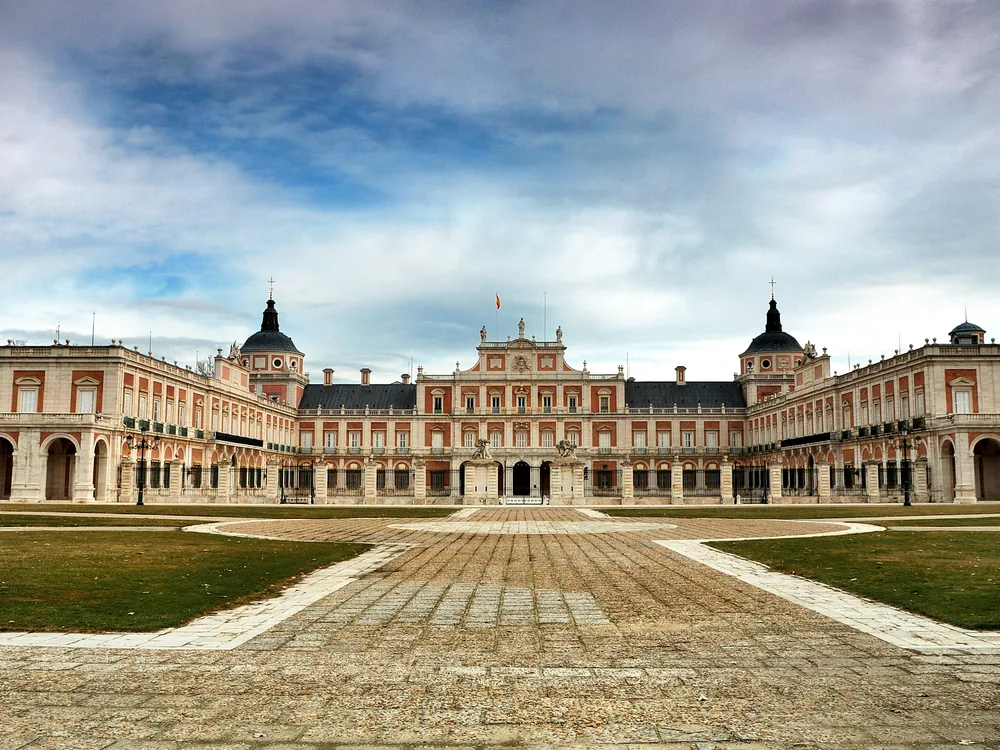 The Aranjuez Royal Palace on the banks of the Tajo River — the Spanish crown's Baroque spring residence and UNESCO World Heritage Site, 45 minutes south of Madrid