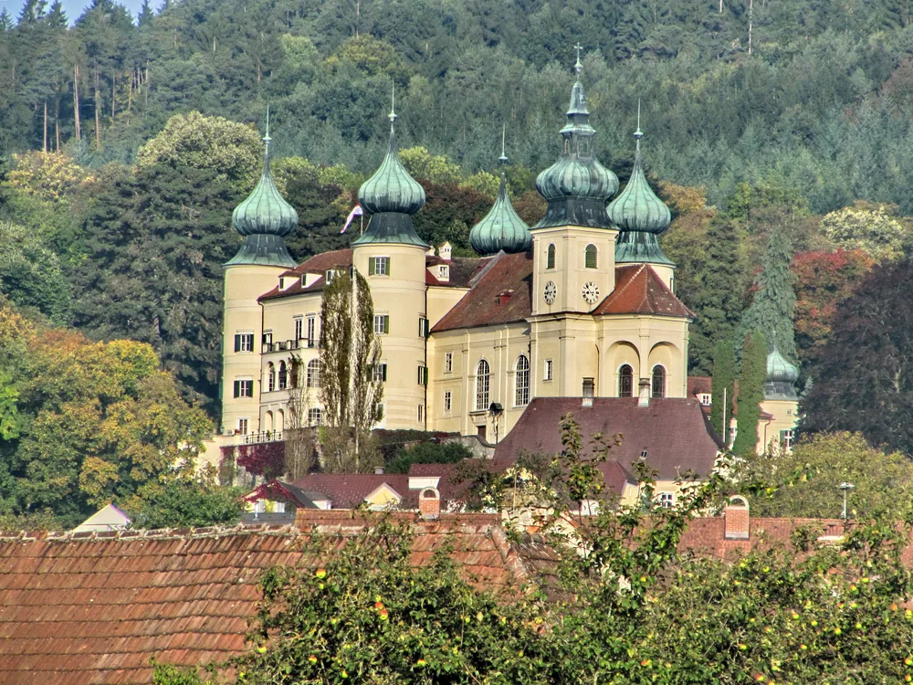 Artstetten Castle with its seven towers above the Lower Austrian countryside near the Wachau Valley — the Habsburg castle where Archduke Franz Ferdinand and Duchess Sophie are buried in the castle crypt