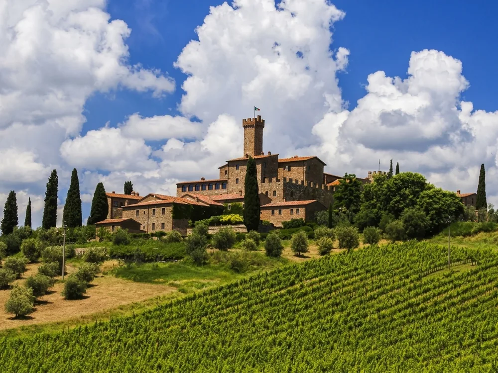 Banfi Castle (Castello Banfi - Il Borgo) near Montalcino, Tuscany, Italy, with the medieval Castello di Poggio alle Mura in the background