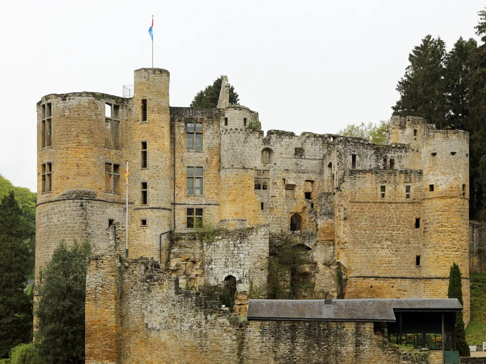 Beaufort Castle ruins in the forested Müllerthal gorges of Luxembourg