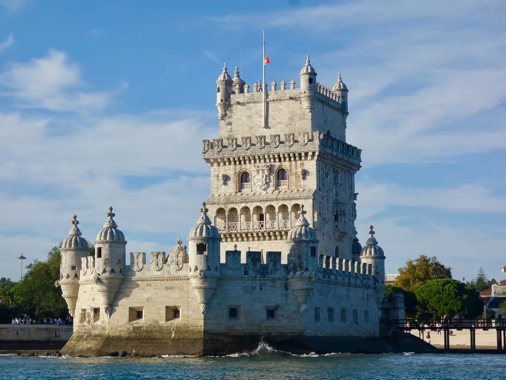 The Torre de Belém on the Tagus River at Lisbon — Portugal's UNESCO World Heritage Manueline tower built 1515–1521, decorated with armillary spheres, twisted ropes, and maritime imagery from the Age of Discovery