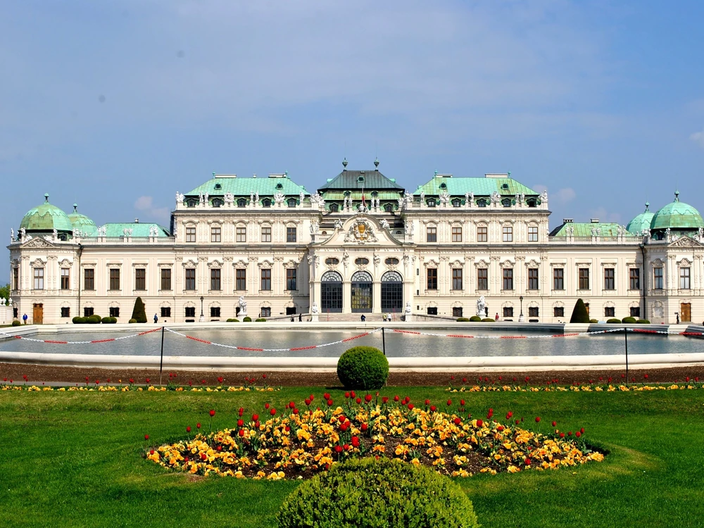 The Upper Belvedere palace in Vienna seen across its Baroque garden, with a cascade of fountains descending the central axis